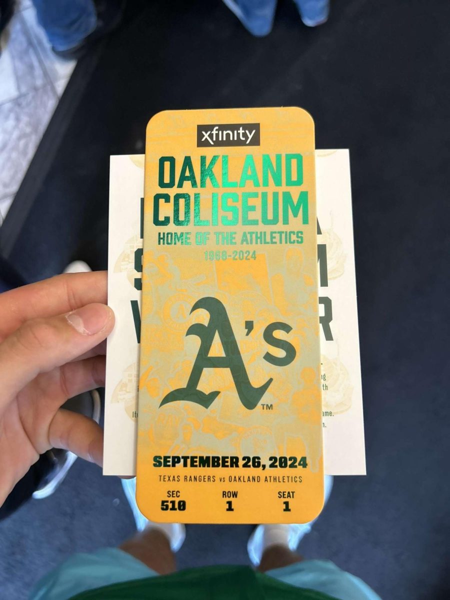 Staff writer Landon Olberg shows off his ticket to the A’s final game in Oakland on Sept. 26.  