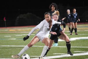 Cal High sophomore Lola Cervantes, left, evades Dougherty Valley defender Hayden Pearson during a league game against the Wildcats in January. Cervantes is hoping to be named to Mexico’s U15 women’s national soccer team later this month.