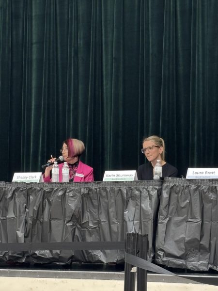 Area 2 incumbent Shelley Clark, left, speaks during the school board candidate forum on Oct. 15 at Iron Horse Middle School while her opponent, Karin Shumway, listens to her response. 