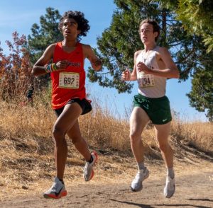 Senior Eshaan Hussain, left, races toward the finish line at the EBAL Championships on Nov. 9. Hussain, who earned All-EBAL honors, went on to place second at the NCS Championships and 14th at the State Finals. It was the best finish at state in Cal’s history.