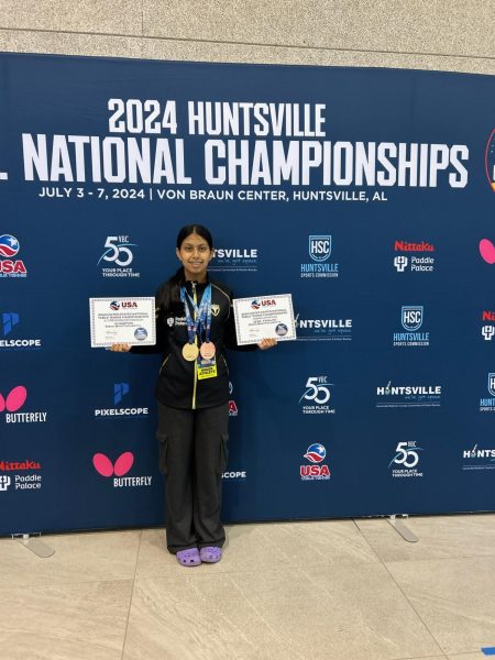 Disha Bhattacharyya displays her awards she won at this year’s US National Table Tennis Championships.