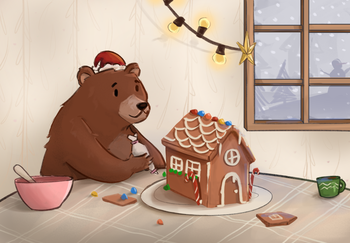 The Californian’s mascot bundles up inside as he cozily decorates his festive gingerbread house on a snowy Christmas day.