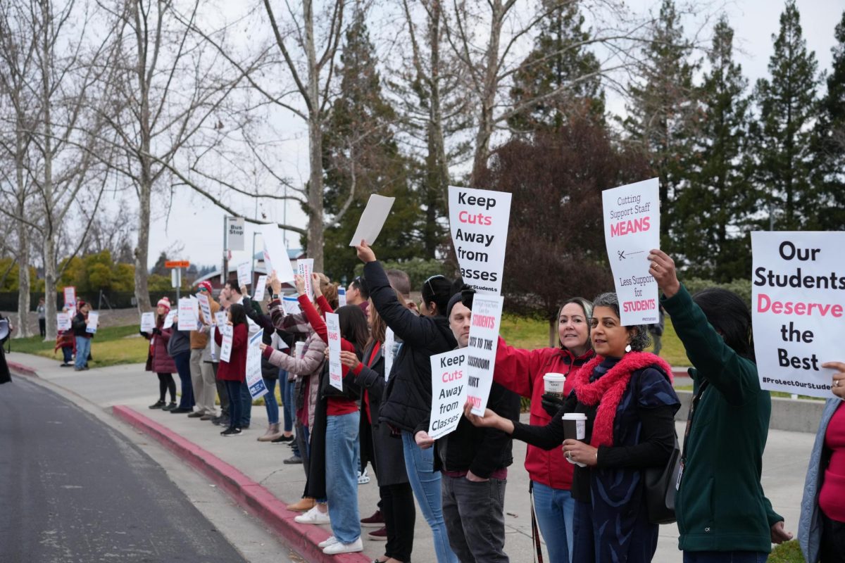 Cal high teachers gather at the front of the school to protest against the budget cuts.