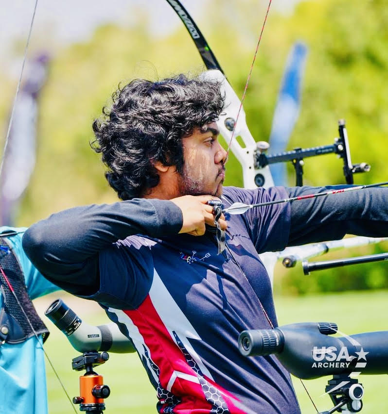 Senior Kaye Malladi draws back a recurve bow during an archery competition for USA Archery. Malladi has risen to among the top 100 archers in the state of California.