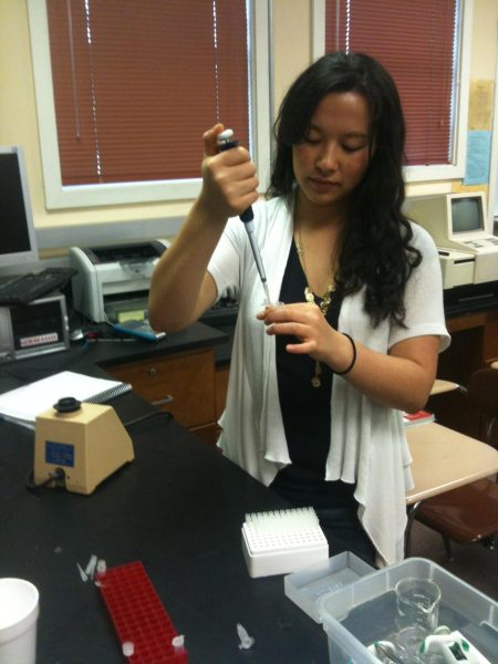 A former forensics student uses a micropipette in class to collect data from micro tube. Current Cal students will get to learn these techniques now that forensics is offered again. 